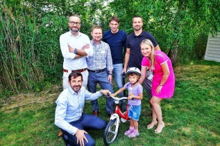 6-2018_Teams of Albert’s managers assembled bicycles together at their meeting and donated them to children