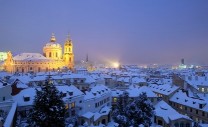prague - st. nicolaus church and rooftops of mala strana in winter